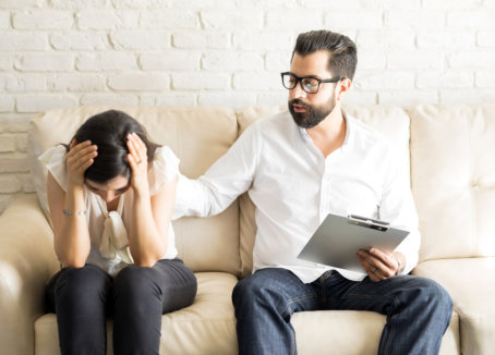 man comforting a woman