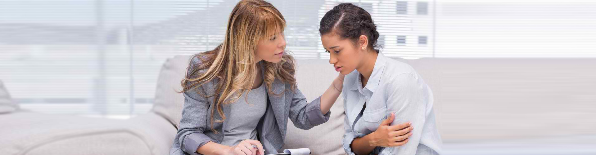 a young female patient having a psychotherapy session with a psychologist